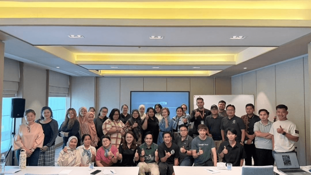 Corporate and public AI awareness workshop participants with Mohd Shanizam in conference room